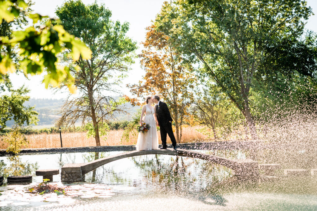 Wedding at the Water Oasis Bride and Groom on bridge