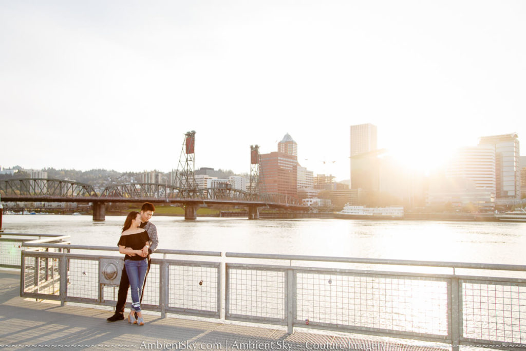 Portland city skyline Engagement photography couple at sunset along the willamette river