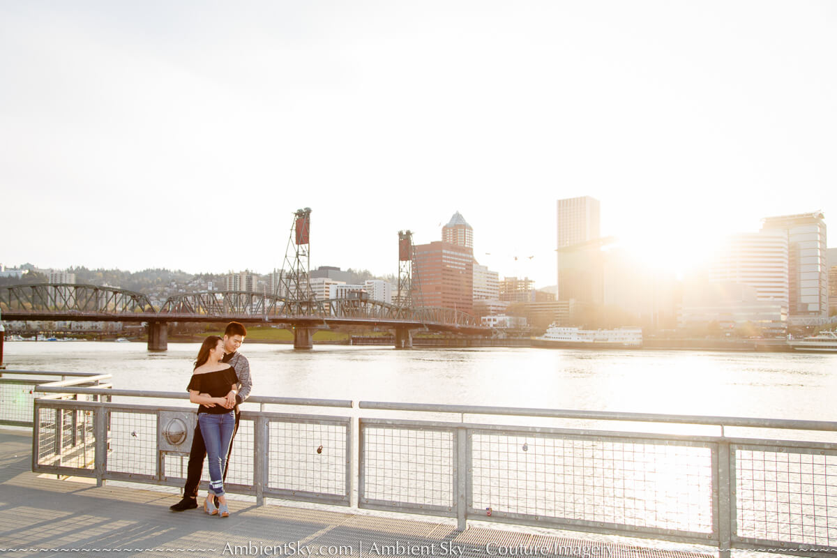 Portland city skyline Engagement photography couple at sunset along the willamette river