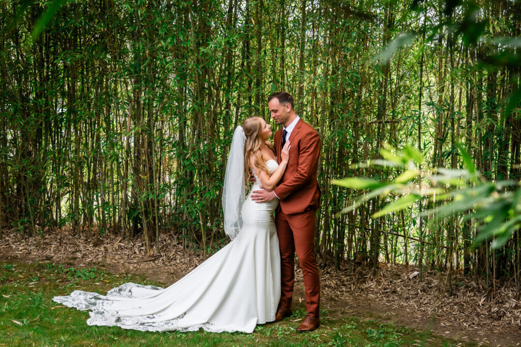 Water Oasis Wedding Portrait of Bride and Groom in the bamboo
