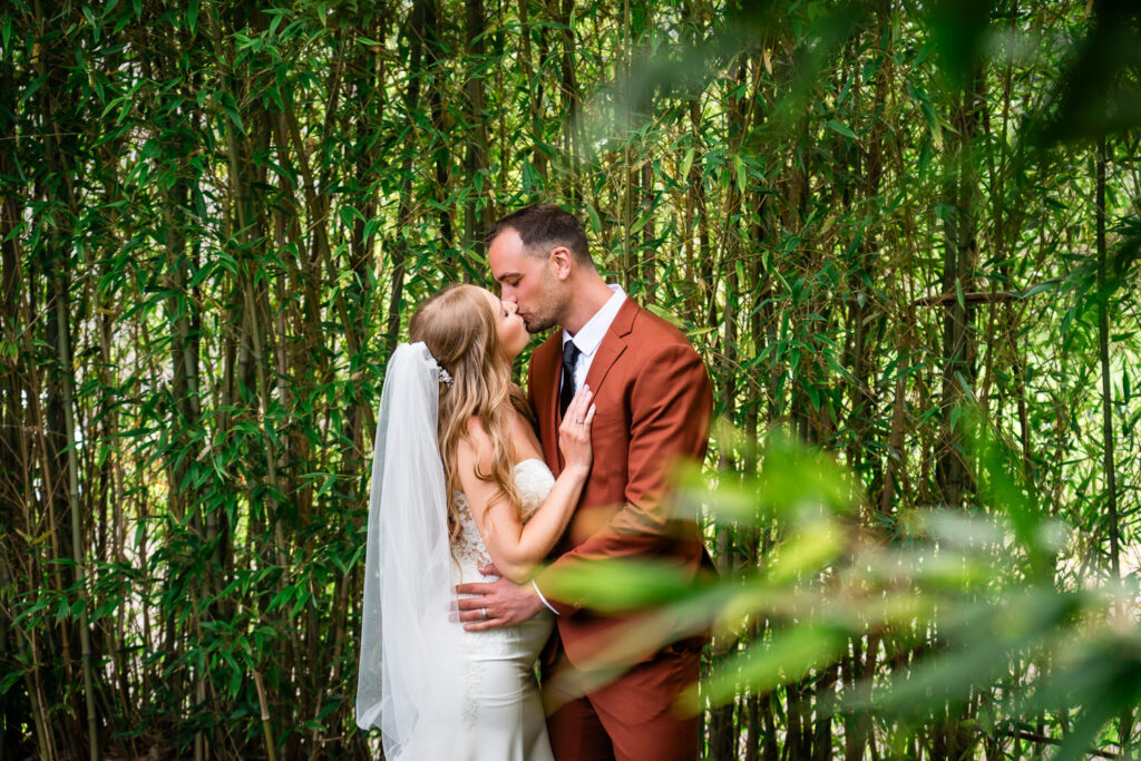 Water Oasis Wedding Portrait of Bride and Groom in the bamboo