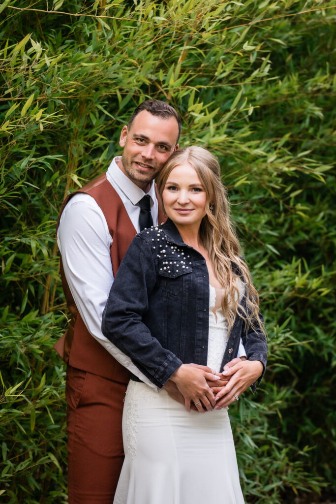 Water Oasis Wedding Portrait of Bride and Groom in the bamboo